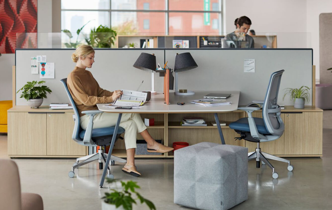 Individual workspace featuring soij office chair with lumbar support and the BuzziCube upholstered pouf. /