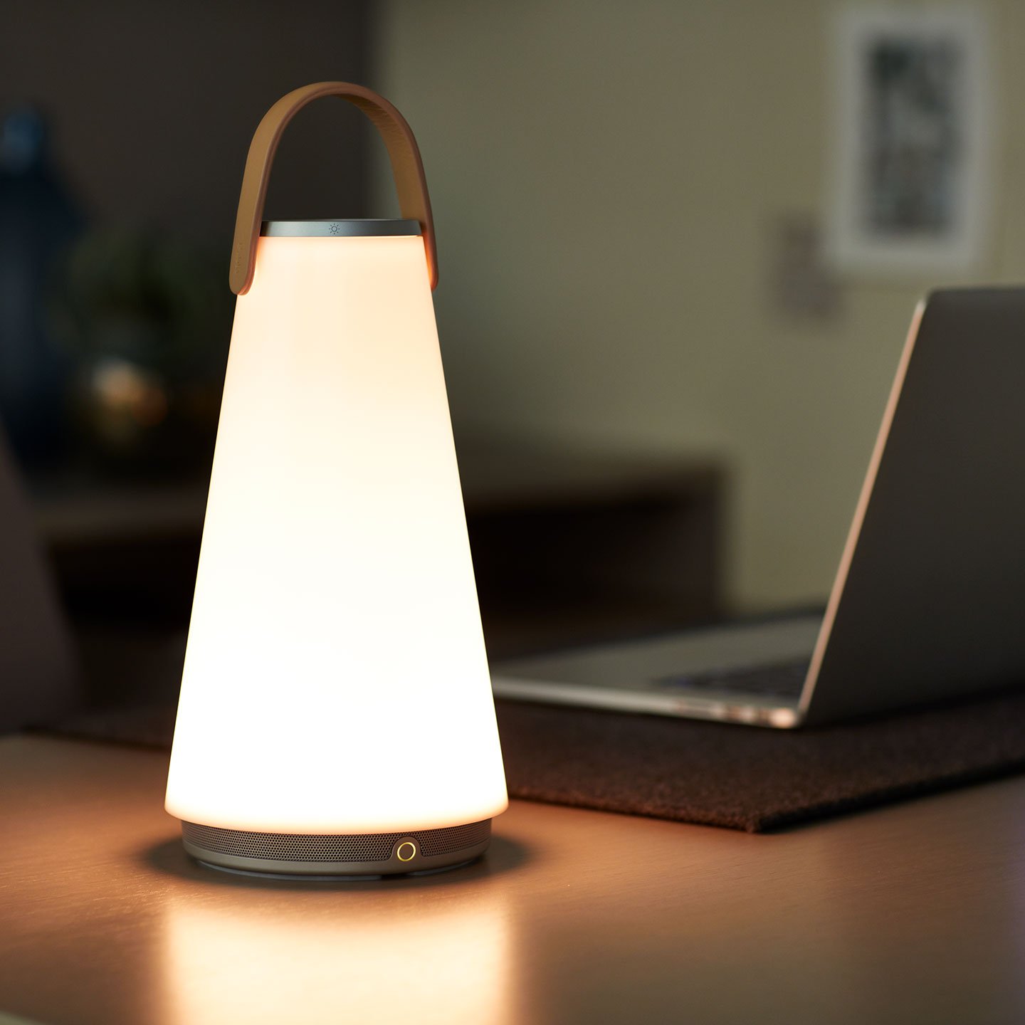 Haworth Uma Lighting with wood handle on office table next to laptop