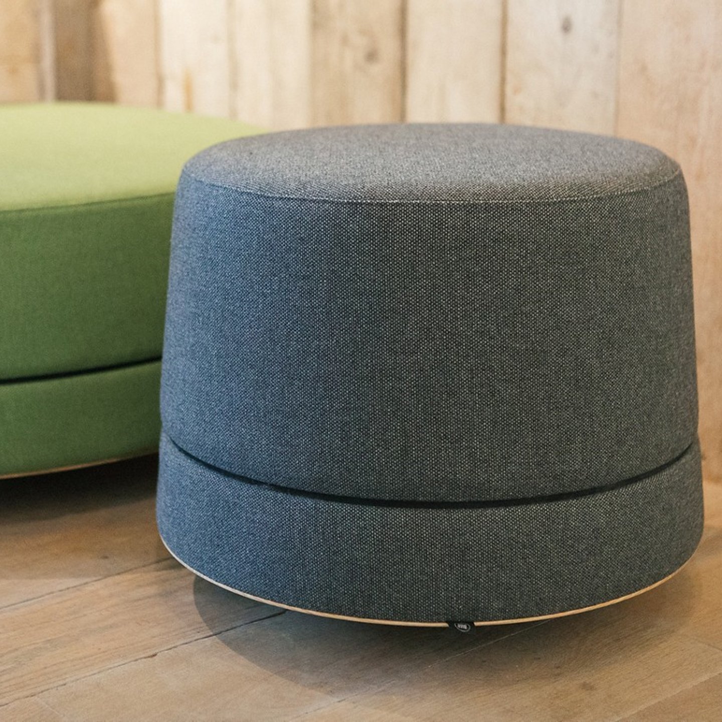 Haworth Buzzibalance poufs in grey and green colors offering acoustic performance and movement activator features