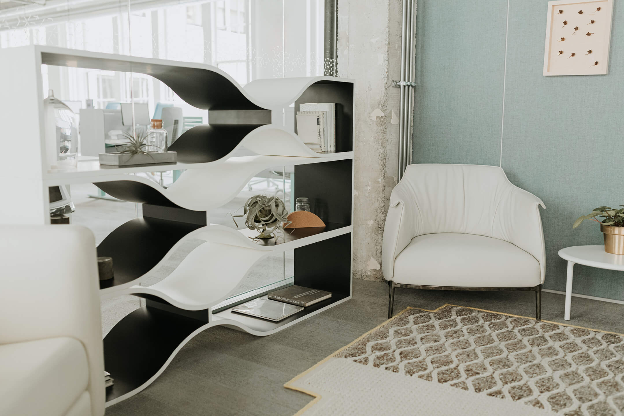 Haworth Design Studio Designer in private office area with white chair