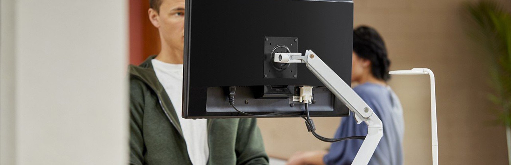 Haworth Ergotron monitor arms in a workspace