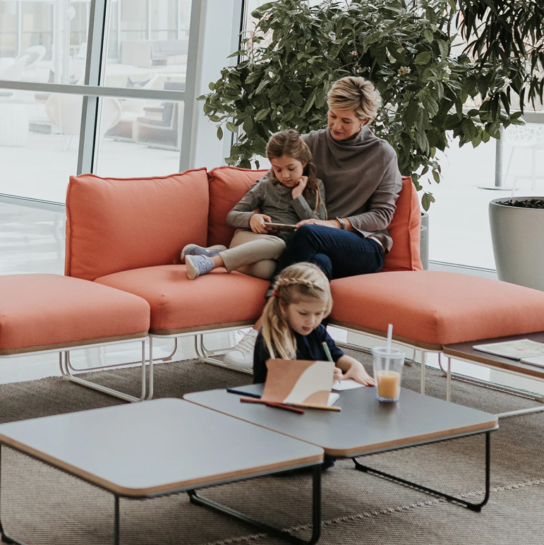 Haworth Resonate lounge in orange upholstery in a lobby space