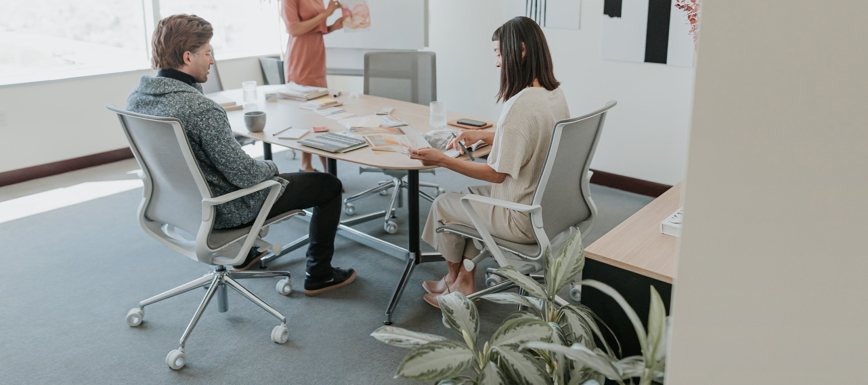 Haworth Zody chair in grey color in a conference room view 2/