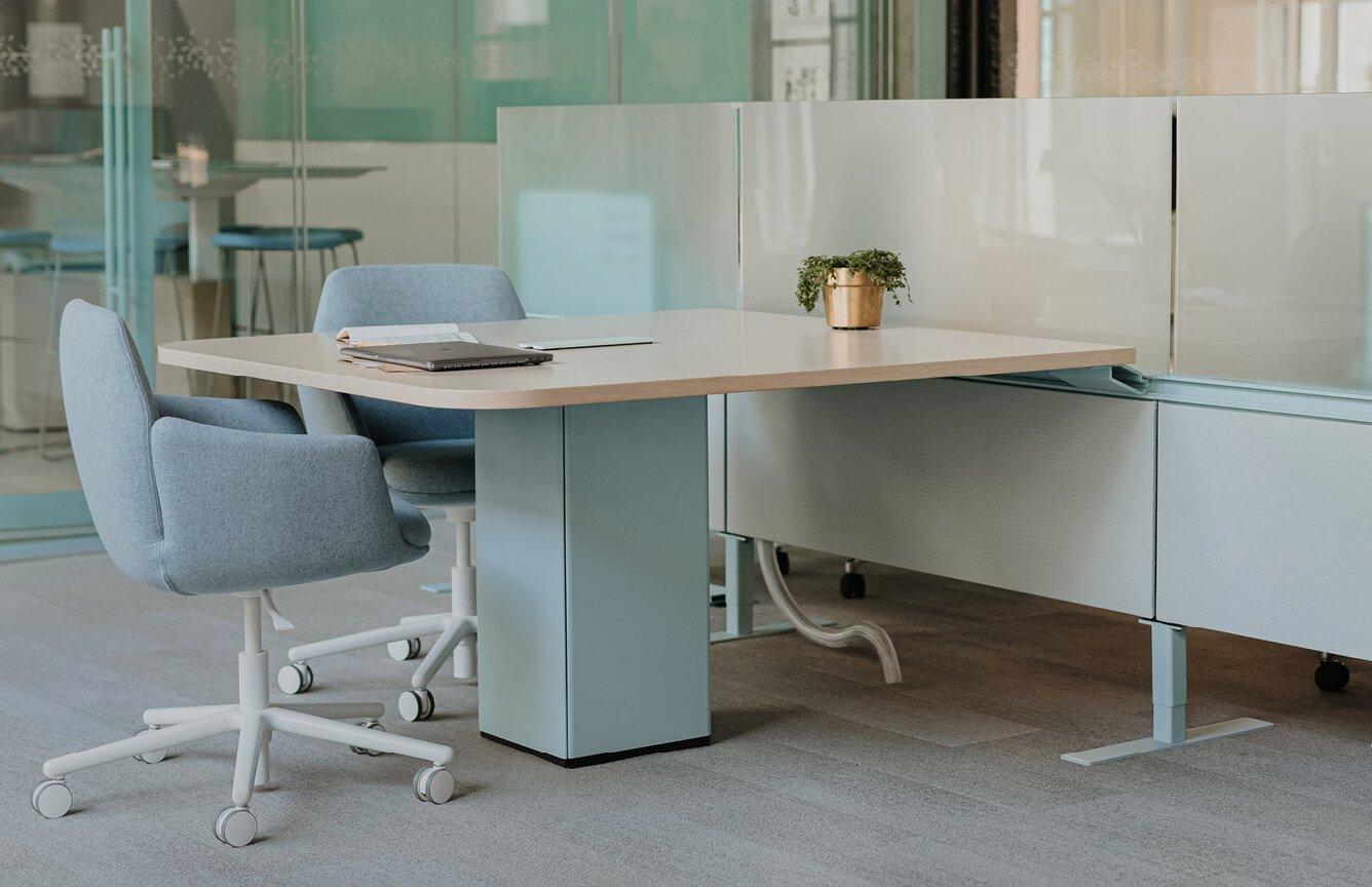 Collaborative space with planes conference table and poppy guest chair..