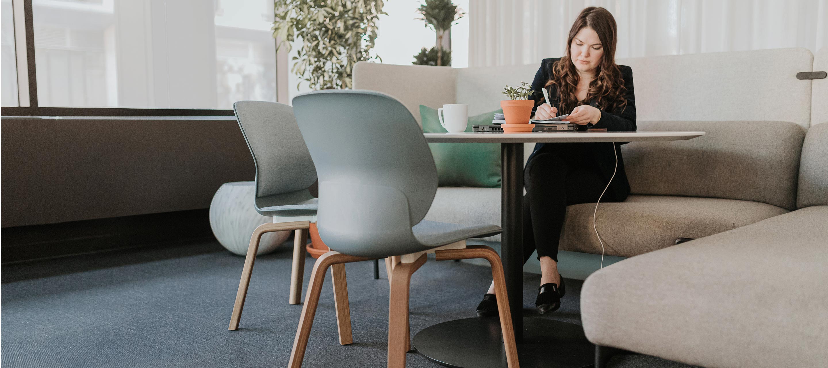 Haworth Maari chairs in mint green color in a office room/