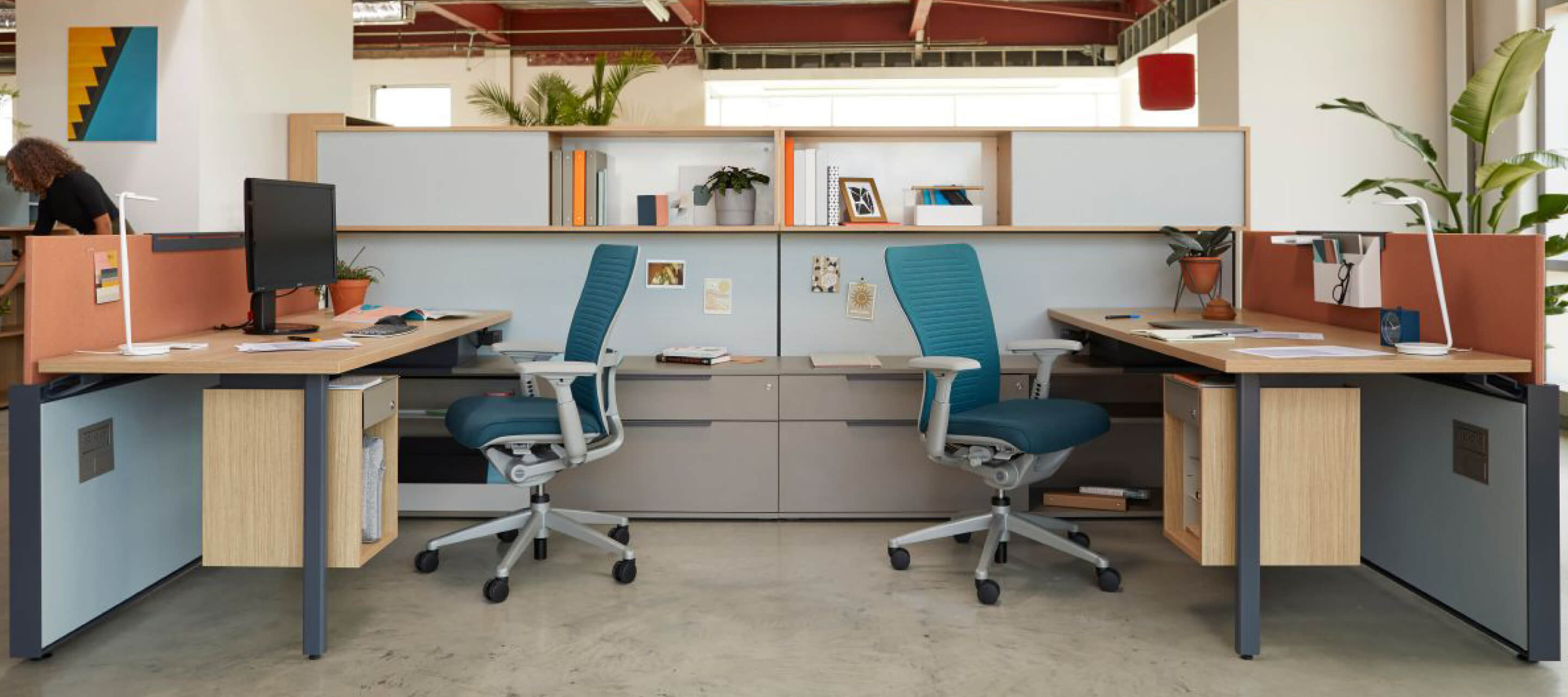 Individual workspaces featuring Zody swivel chairs and Behold office storage.