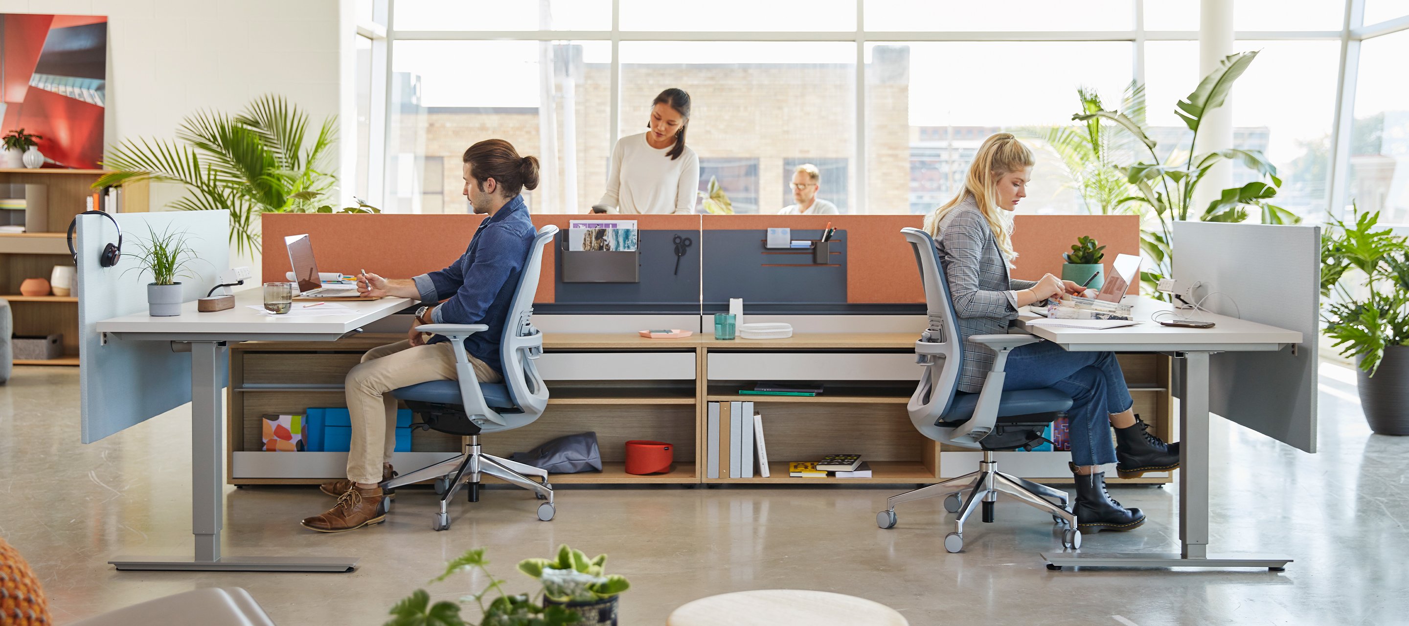 Haworth Zody chairs and Height adjustable table at 2 workstations in an office/