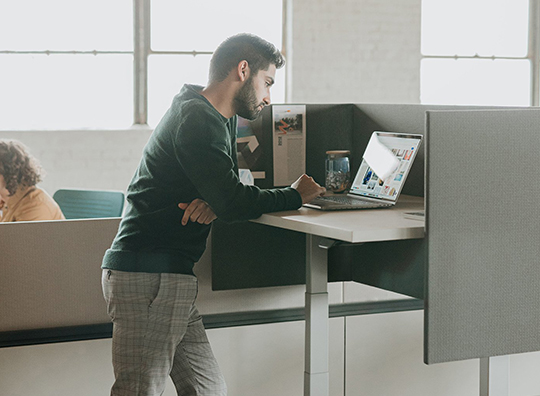 Haworth Upside height adjustable table in a office space