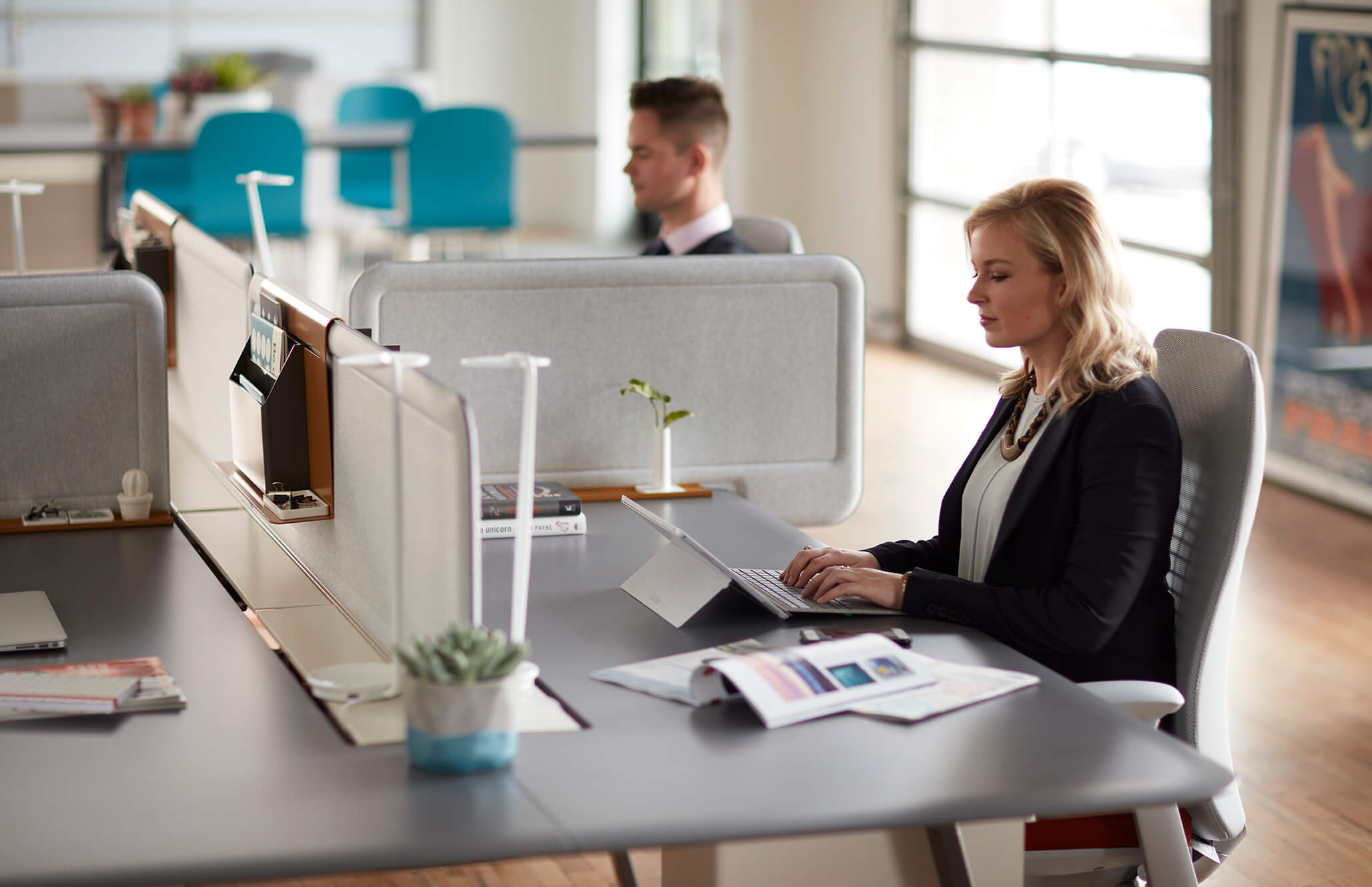 individual workspace with a white fern chair.