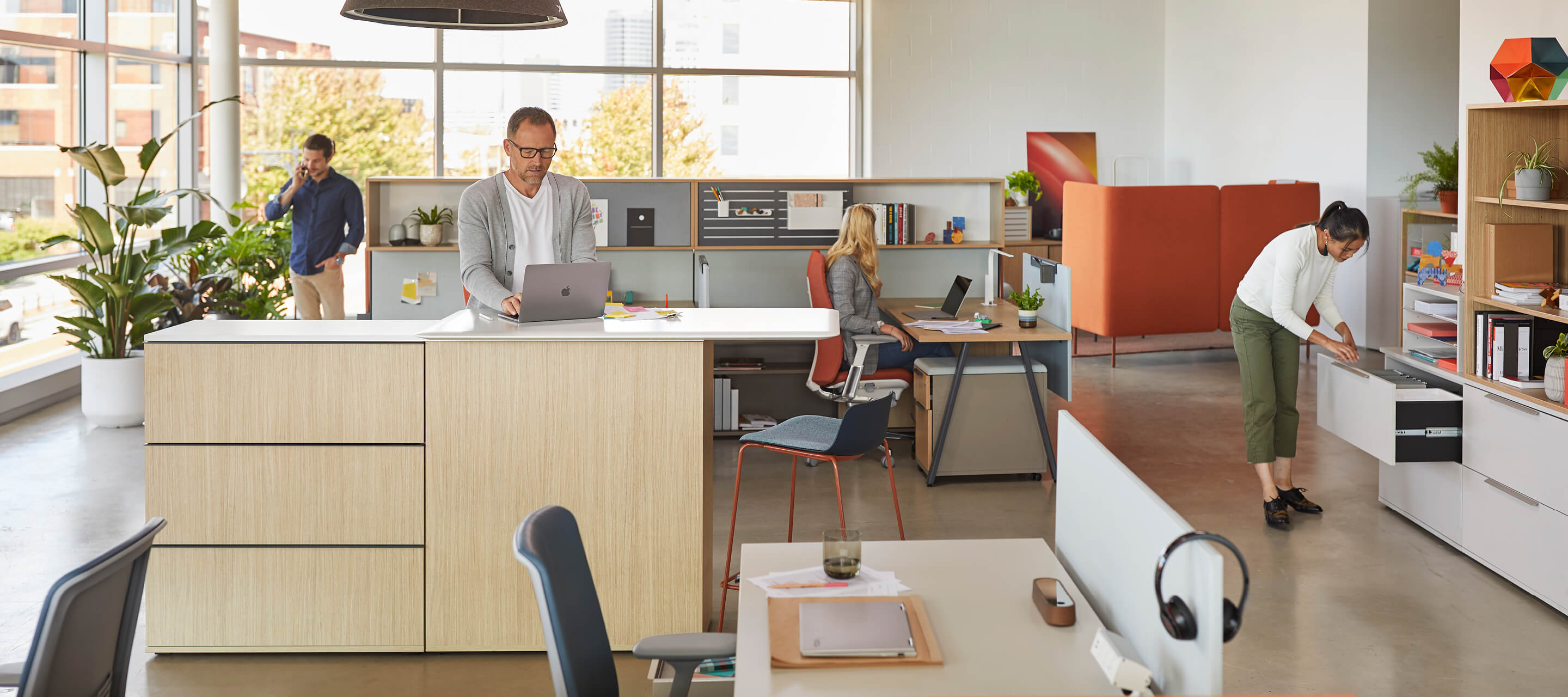 Office with individual work spaces and accessible storage 