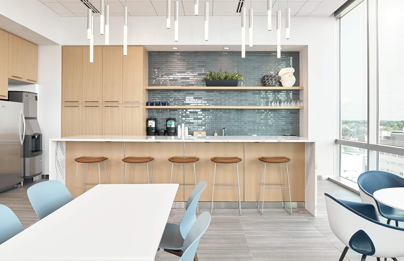 Haworth Maari chairs, Hi Pad stools in brown in a cafeteria