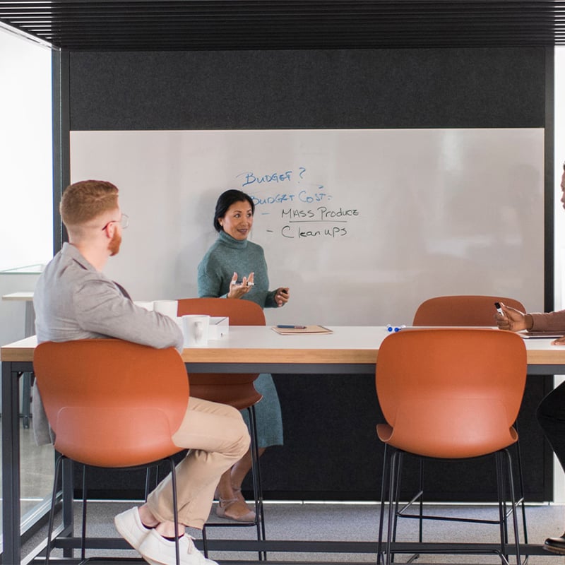 Haworth Maari high chairs in orange in a meeting space view 2