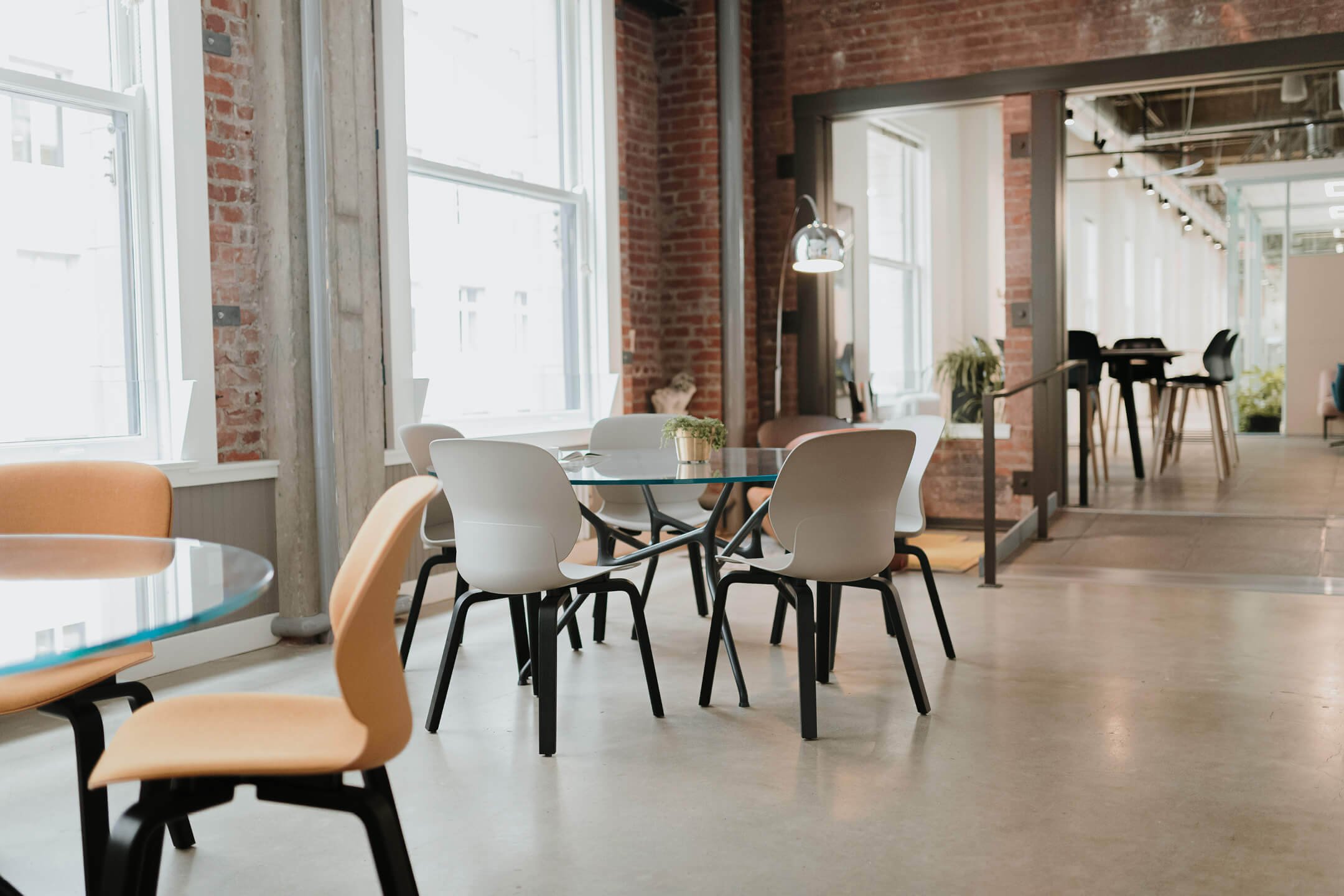 Group space featuring branch tables and maari chairs. This space is ideal for dining or group work.