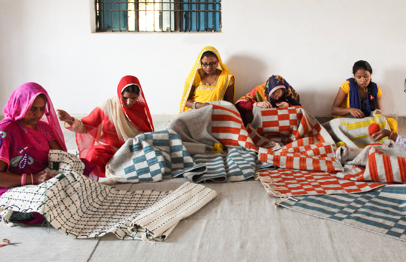 GAN rug being woven by women in India