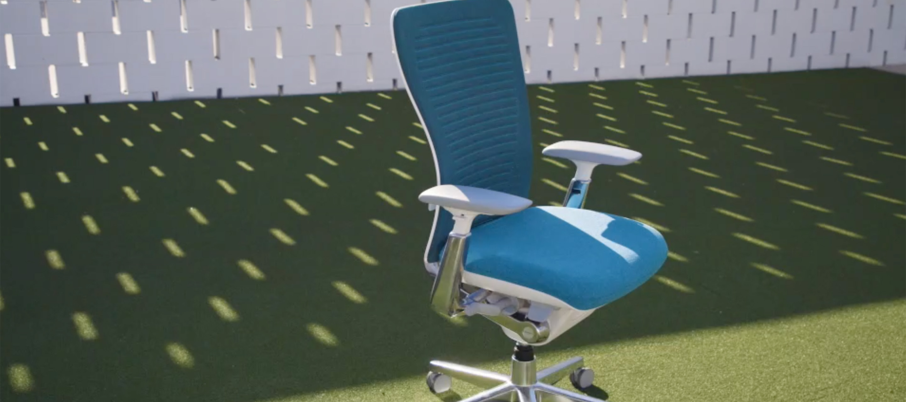 Haworth Zody chair in blue upholstery in a lawn area