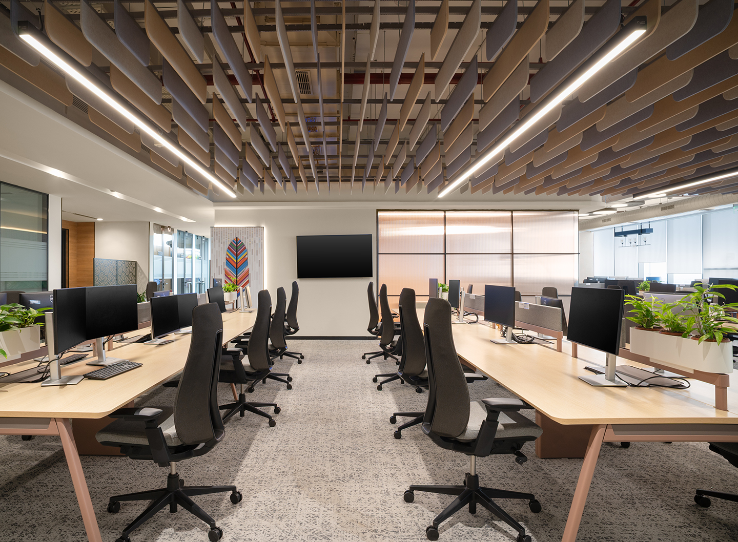 Linear workstation layouts provide flexibility while maintaining a consistent workplace identity.