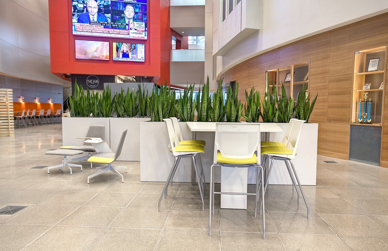 Haworth Very Side & Seminar chairs in yellow and white in a lobby space