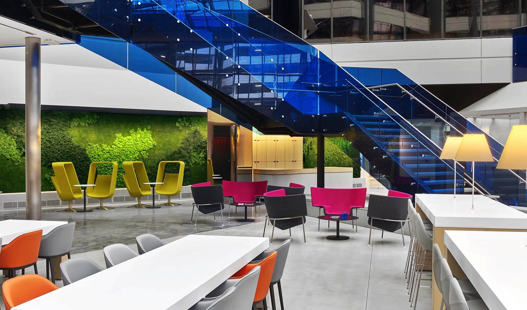 Groupings of Windowseat and Capo lounge chairs in bold pops of color surround the staircase—bringing energy and zest into the social space. The building provides several social spaces designed to support Draper Labs’ creative and collaborative culture.