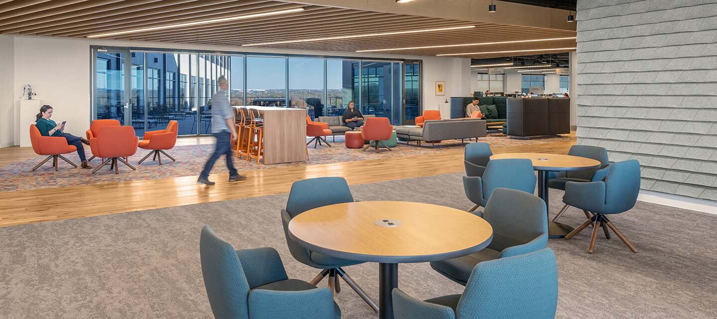 A number of social spaces were designed for casual collaboration, individual work, or small team meetings. Pieces like the Poppy Lounge chair, GranTorino HB lounge seating, and Pebble ottoman provide soft and comfortable seating options. The social spaces also provide ample access to charging stations. 