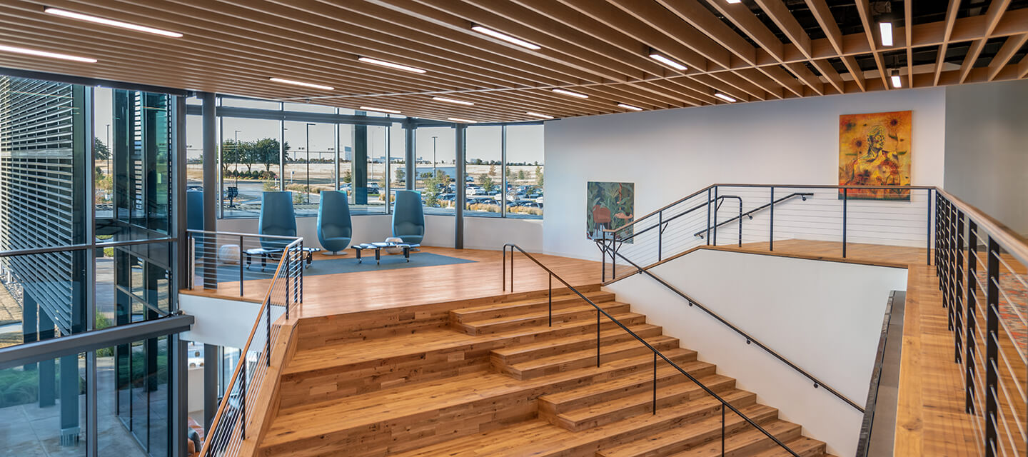 The staircase leads to the mezzanine area that features four iconic Wanders’ Tulip chairs. Each chair is designed to allow the opportunity for both personal privacy and casual conversation. 