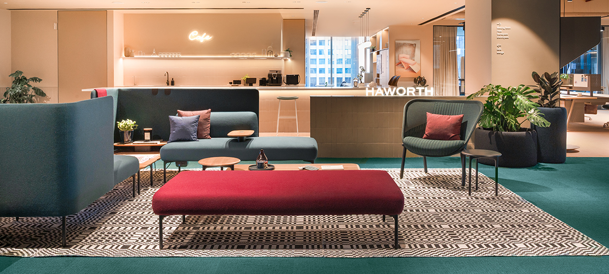 The Welcome Lounge with Fabric Display & Test Drive signage is designed as an interactive space where visitors can explore fabrics, textures, and finishes while experiencing our products in real time. It’s a place that blends inspiration with engagement; inviting you to discover comfort, style, and function first-hand. The setting features a mix of Cabana lounge seating, Sprig and Cabana tables, BuzziPleat lighting, BuzziSpot Seating and the versatile Pip low table. Together, this area makes product testing and fabric exploration an engaging, welcoming experience.