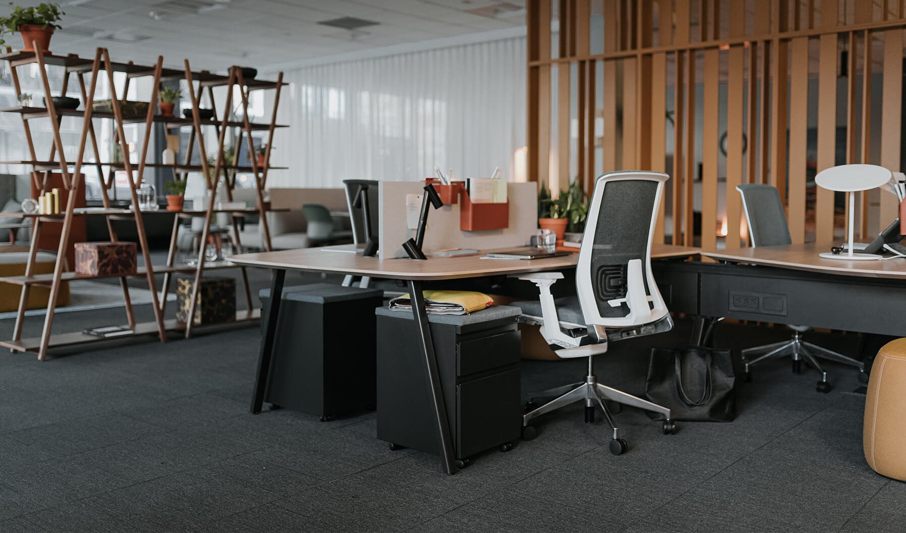 The layering of spaces is demonstrated here in showing how a
workstation can be a close neighbor to other Social Spaces and lounge
areas. This environment allows for work to be done but the ability to be
connected to what is happening within the office environment.