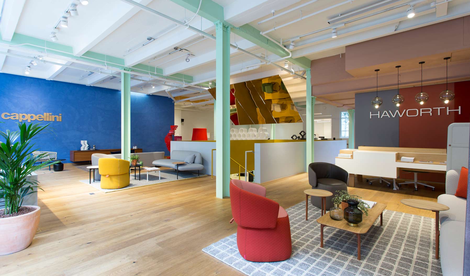 The London showroom reception area, featuring Openest lounge furniture and a GAN rug.