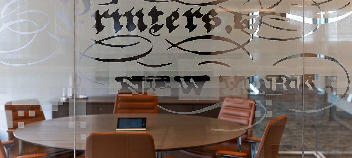 Enclose walls and Lotus chairs in a private conference room at Haworth's Harper Collins client space.