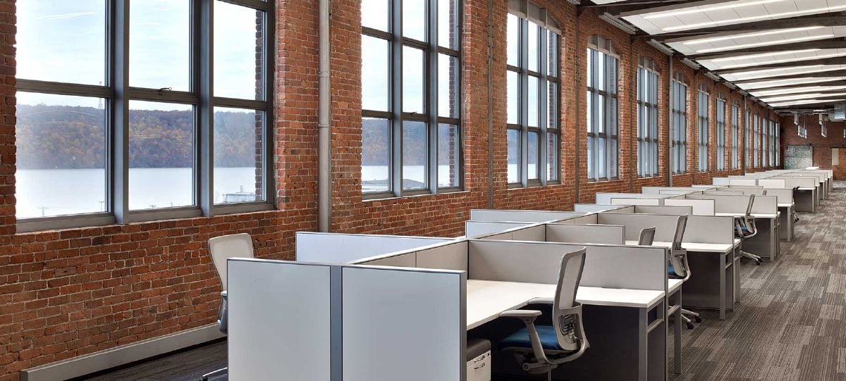 Surrounded by riverfront views and original architecture, the new headquarters provides an ideal atmosphere for workers spanning the disciplines of marketing, product management, customer support, IT, and administration.