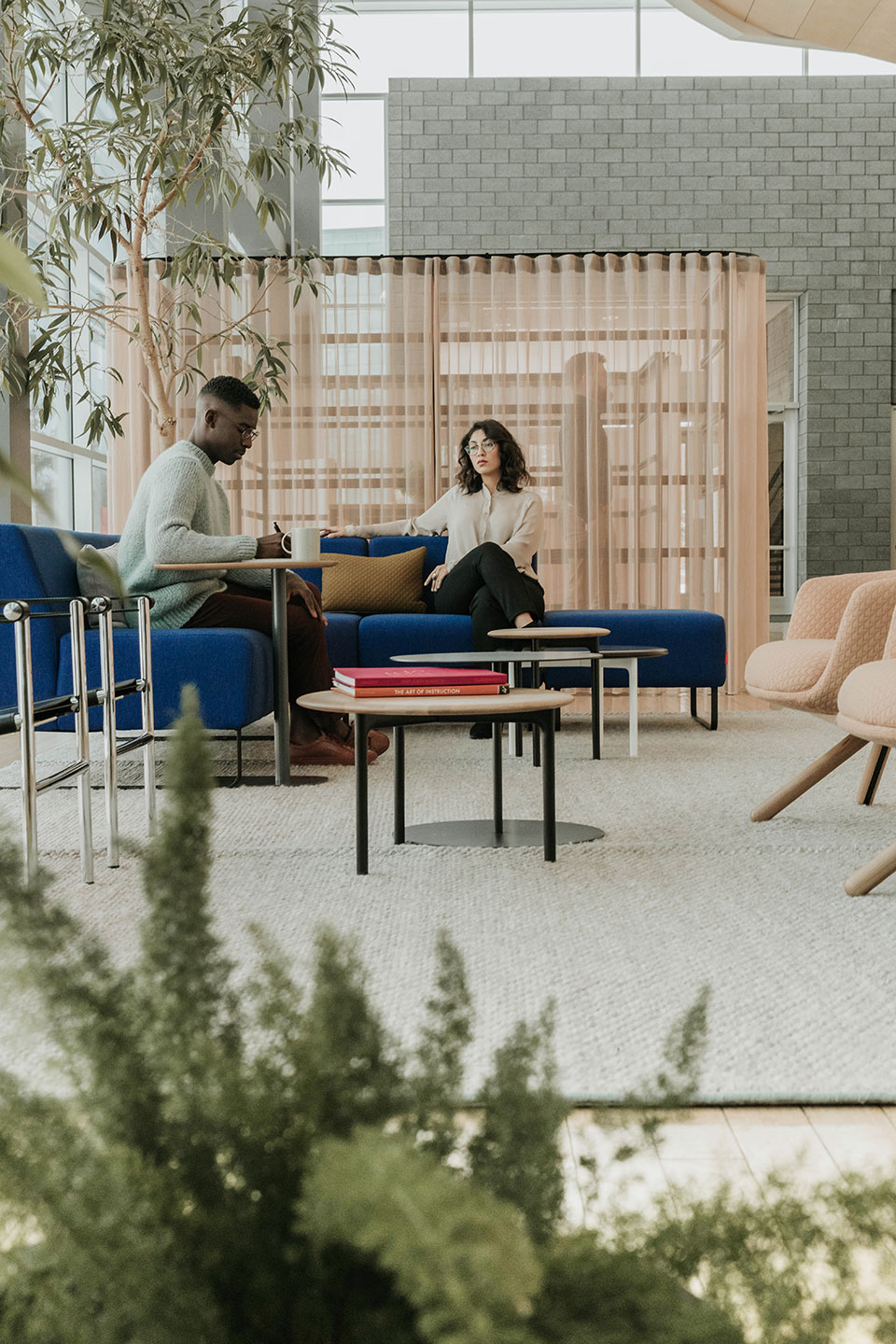 Haworth Openest Sprig Side Table in a office casual collaboration area used as a book table