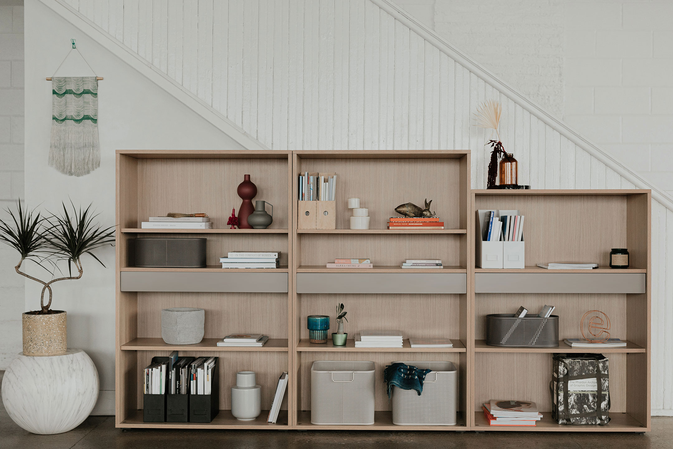 Be_Hold bookshelves in wood at varying heights. 