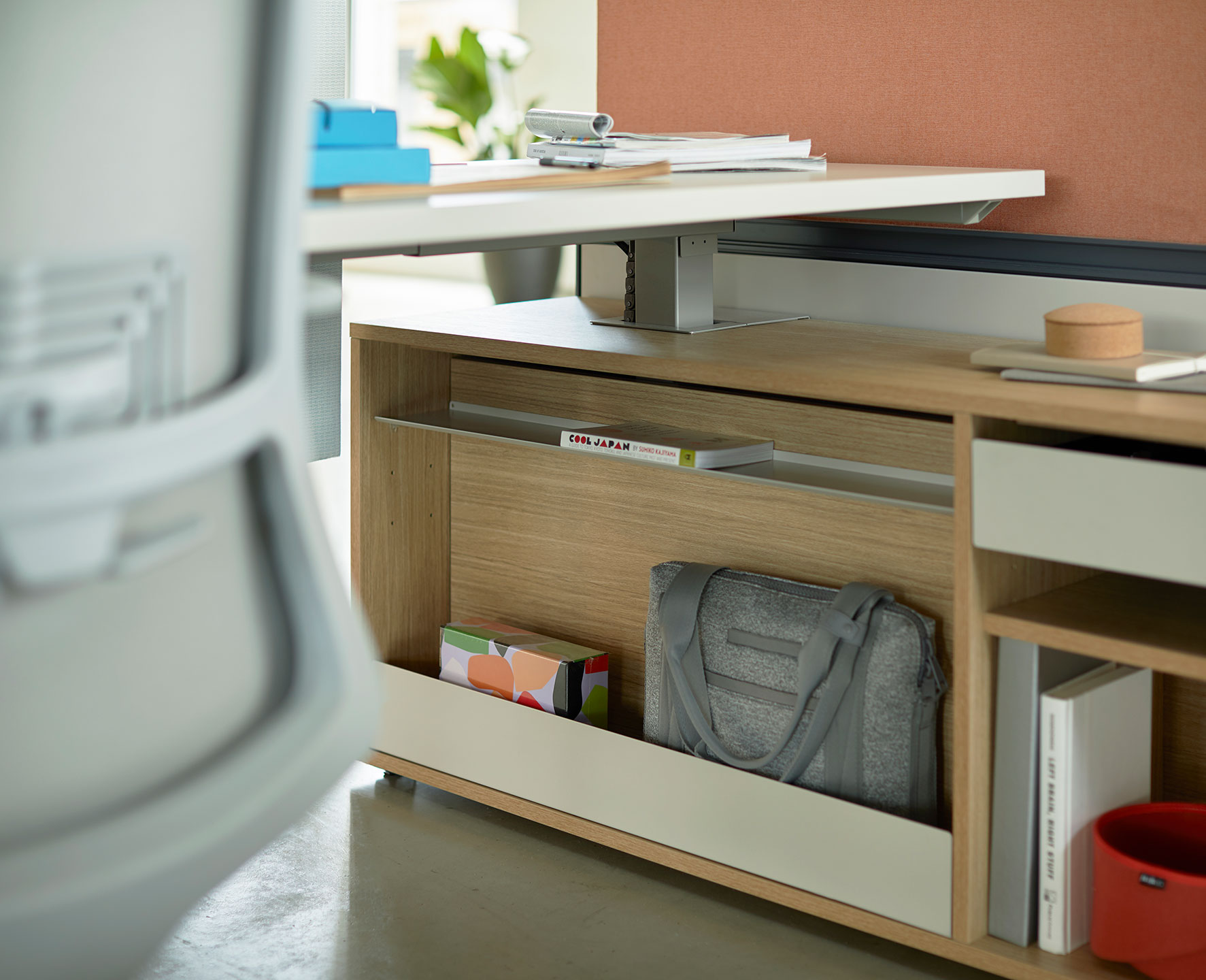 Be_Hold Storage unit in wood underneath desk at individual work space. 