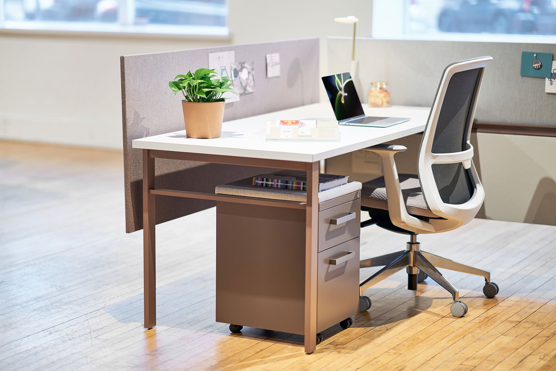 Haworth Belong Work Tools Accessories on a desk with a laptop and haworth chair