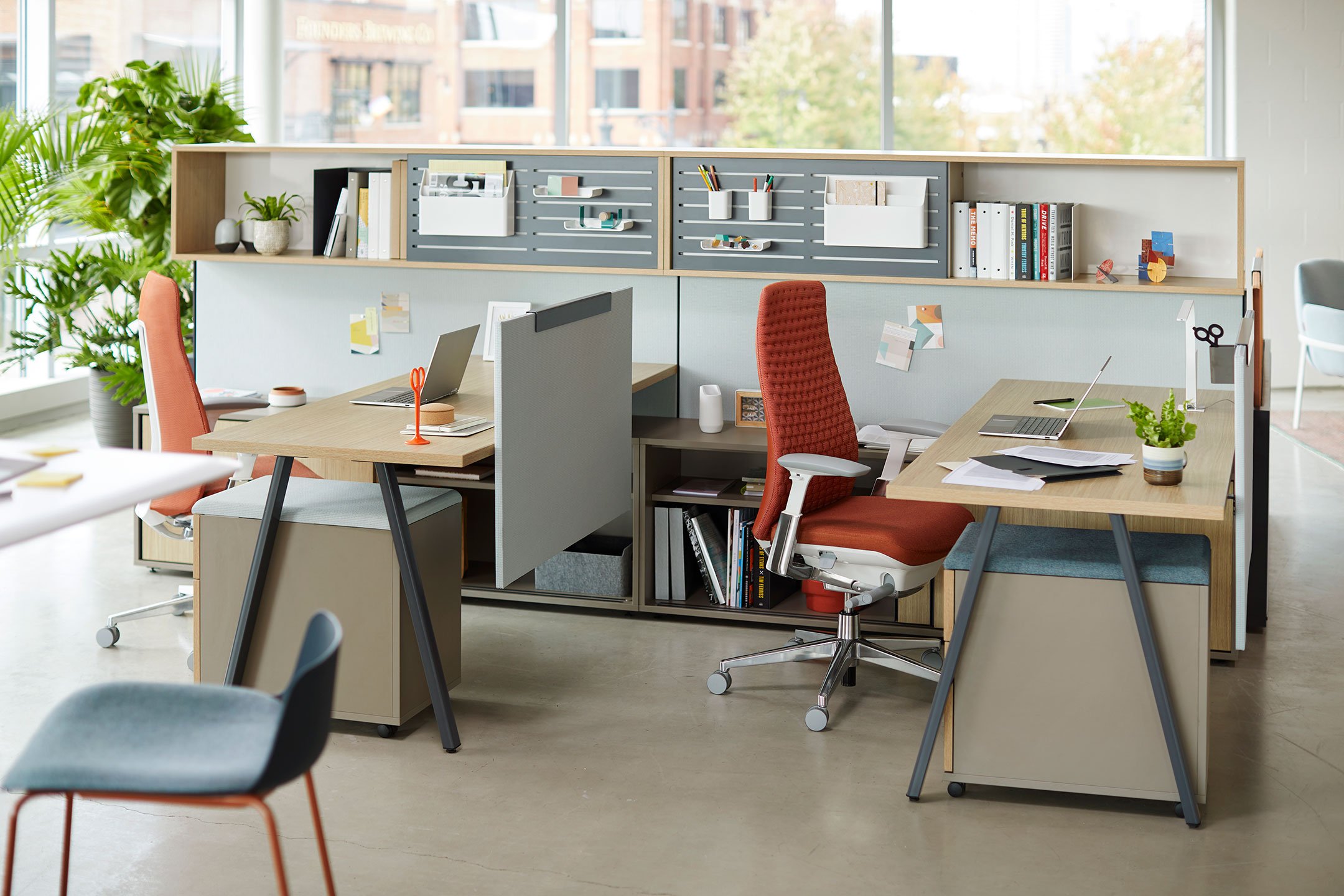 Haworth Belong Work Tools Accessories on a desk with a laptop and a Fern chair