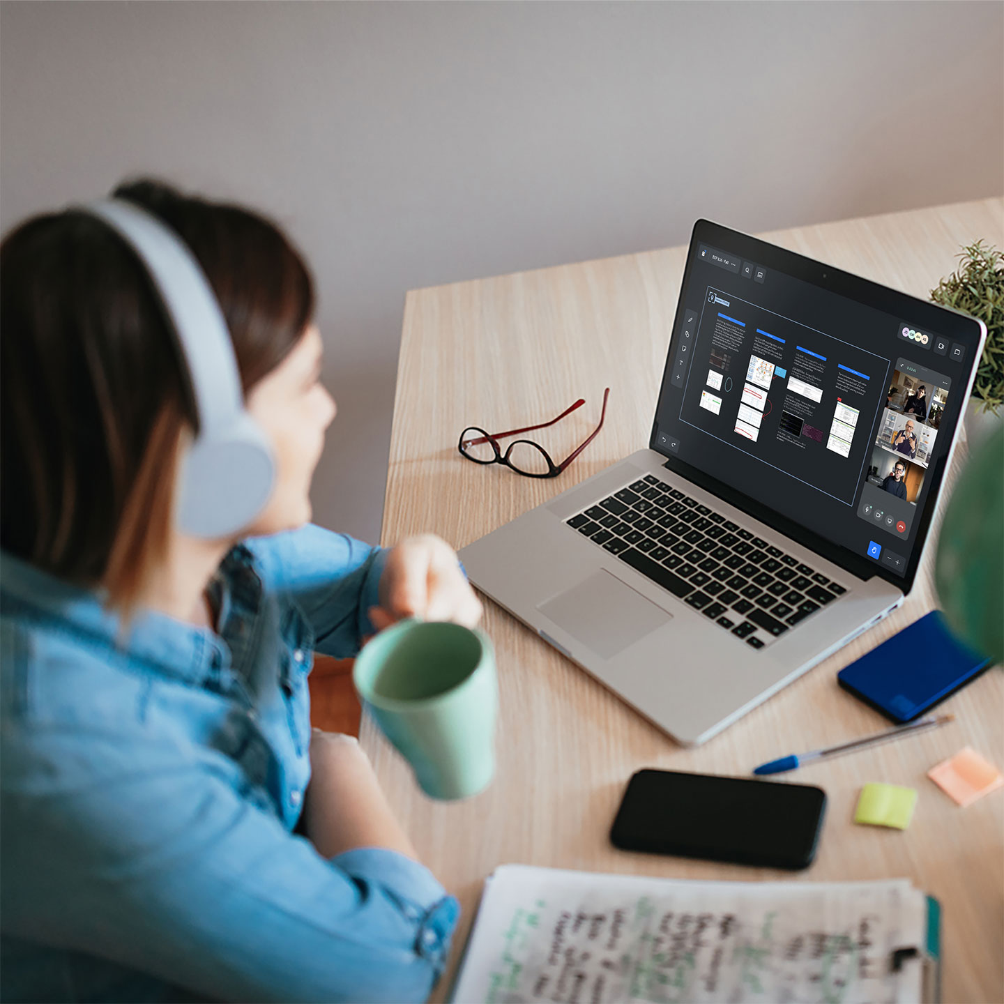 Haworth Bluescape Accessories at a table with a workspace being used by multiple people in a video call