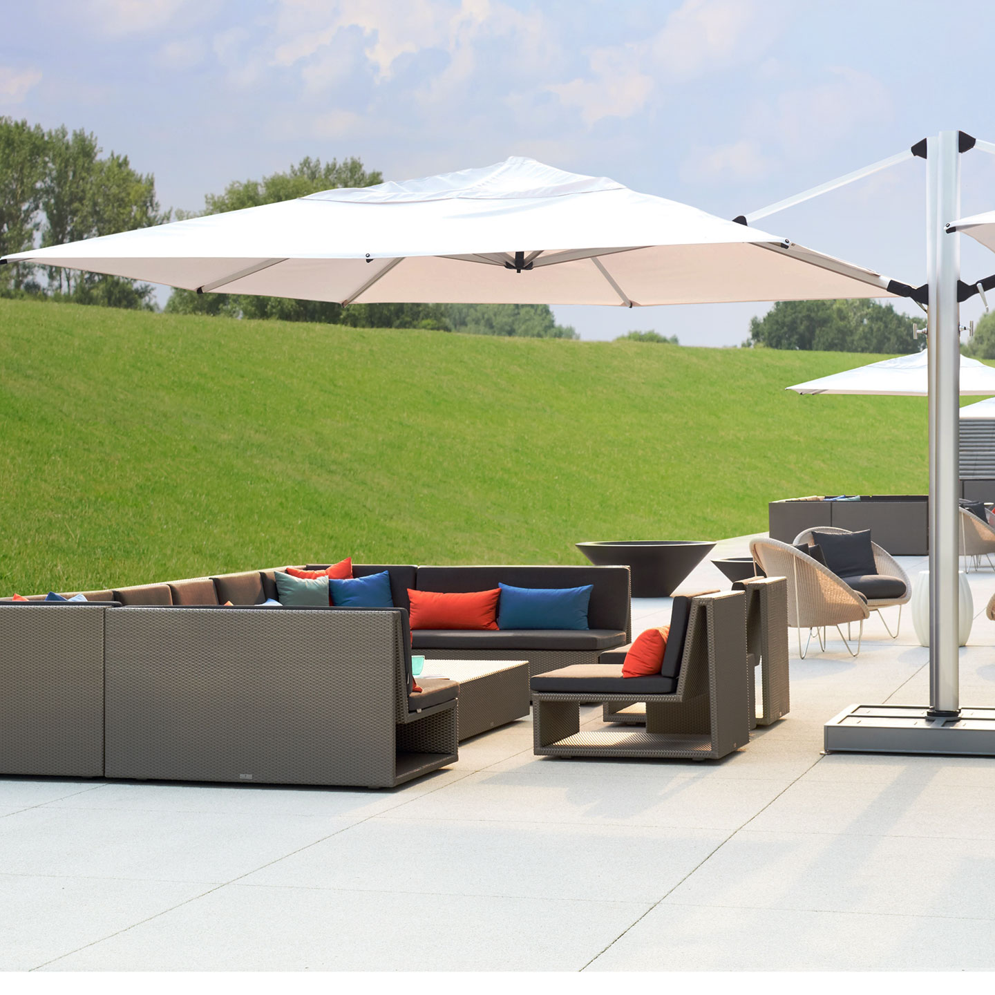 Haworth Janus Titan Umbrella Accessories on outdoor seating area covering outdoor sectional 