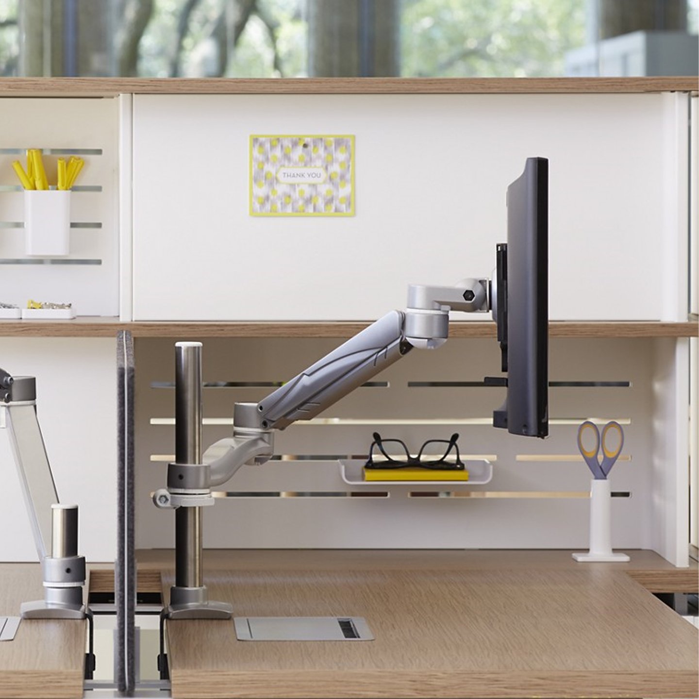 Haworth Monitor Arm Accessories at a desk in an office space