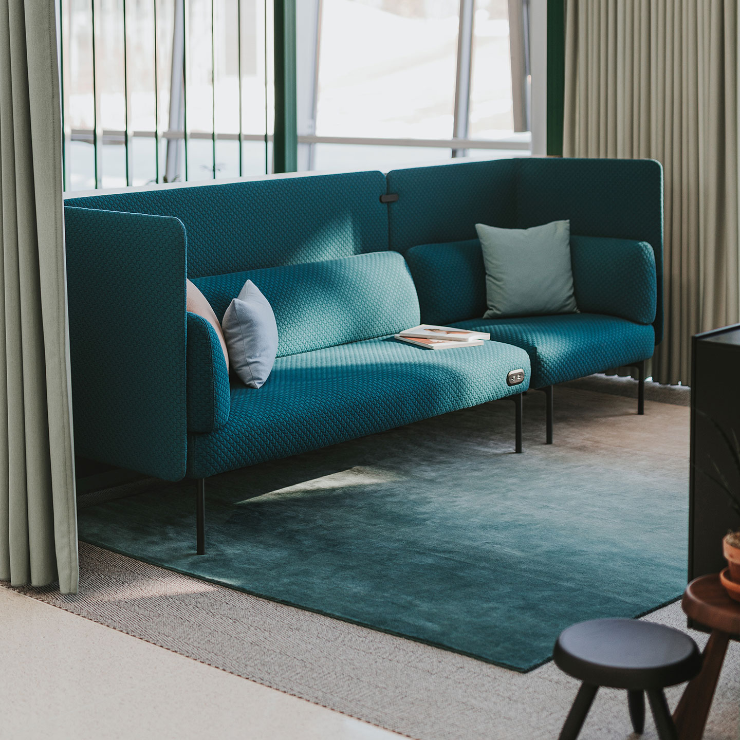 Haworth Cabana Lounge in blue color in open office space with blue rug