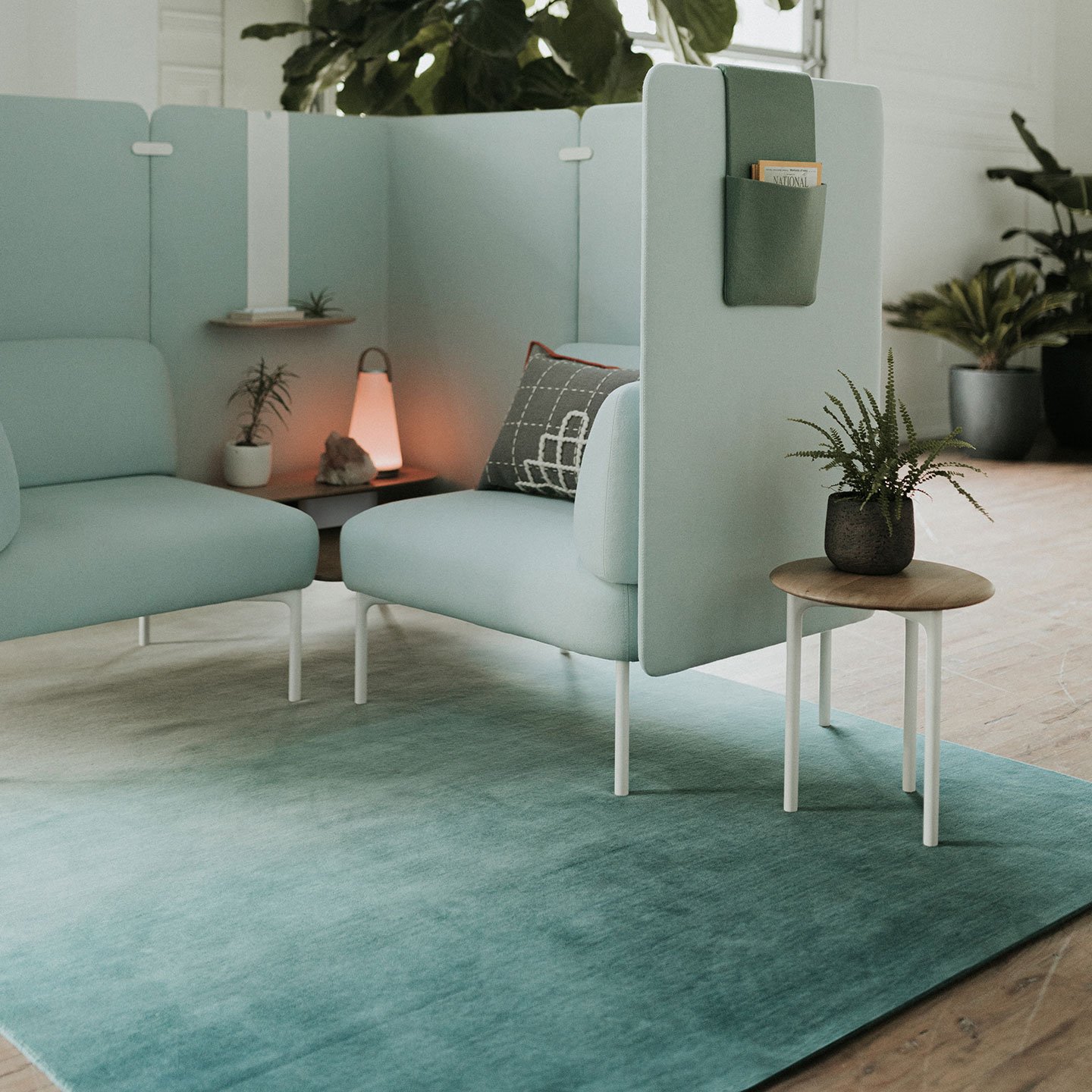 Haworth Cabana Lounge in green color with coffee table next to it on green rug