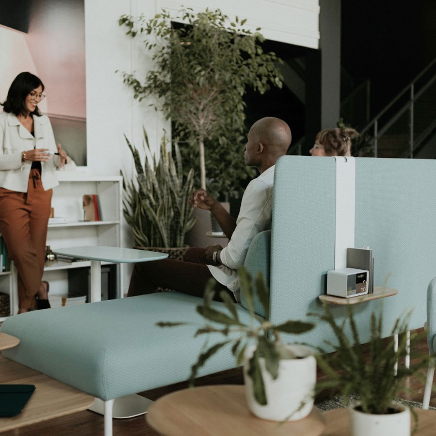 Haworth Cabana Lounge in green color with employees working at space 