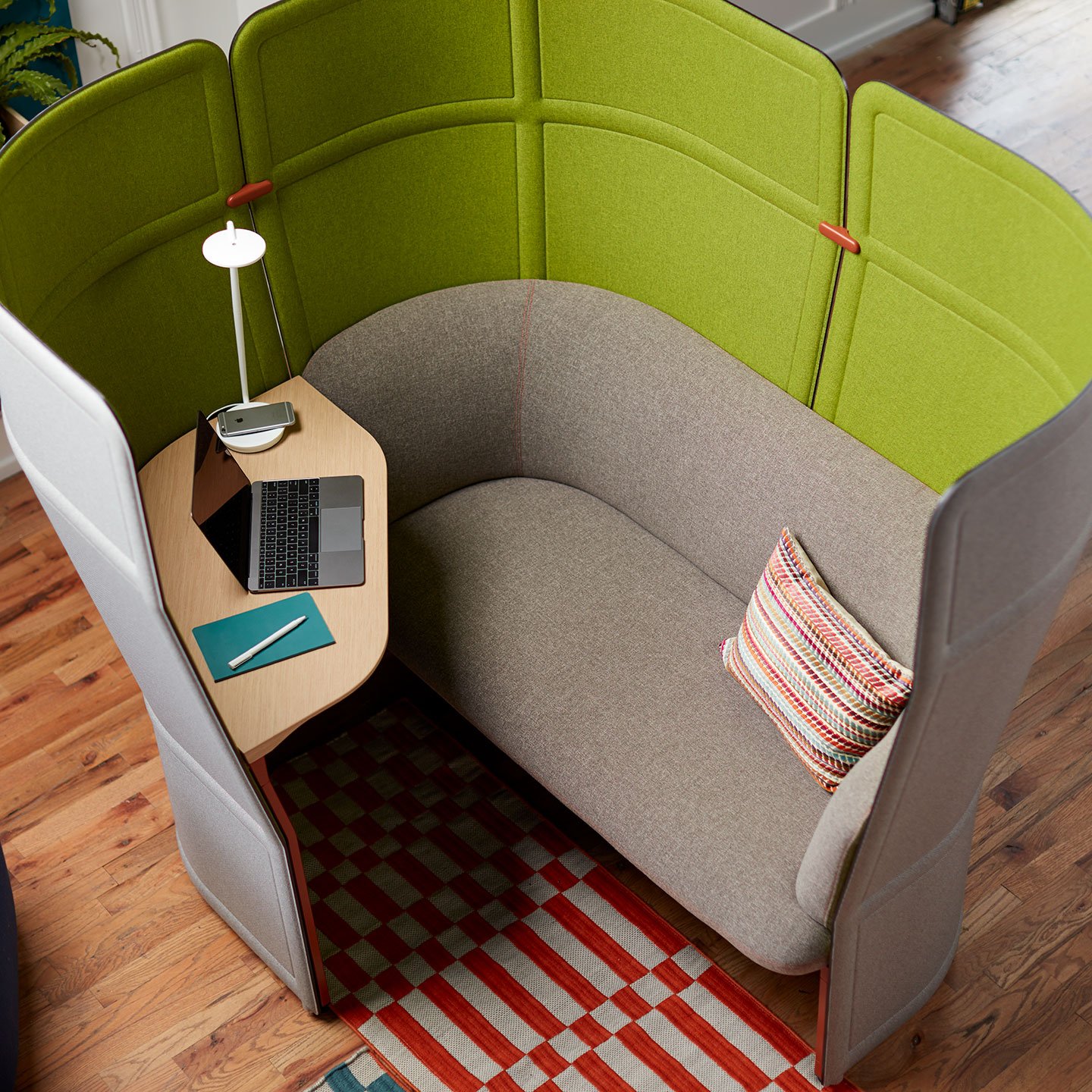 Haworth Openest Corner Booth with grey outside and lime green inside with grey seating and laptop on corner table 