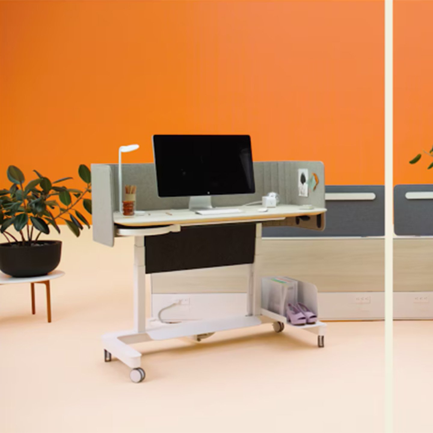 Haworth Compose Echo workspaces against an orange background