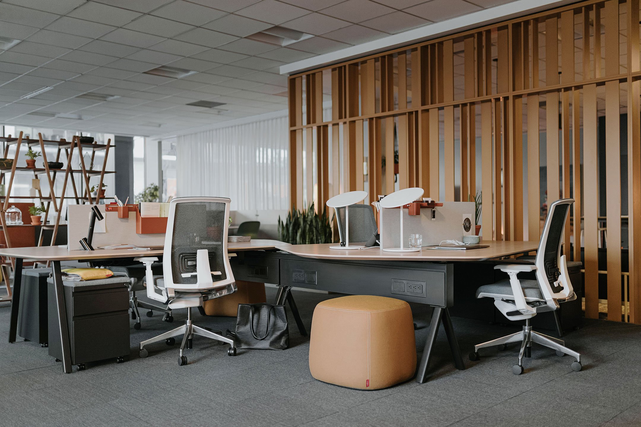 Haworth Compose Beam Divider in office space with wood wall and desk