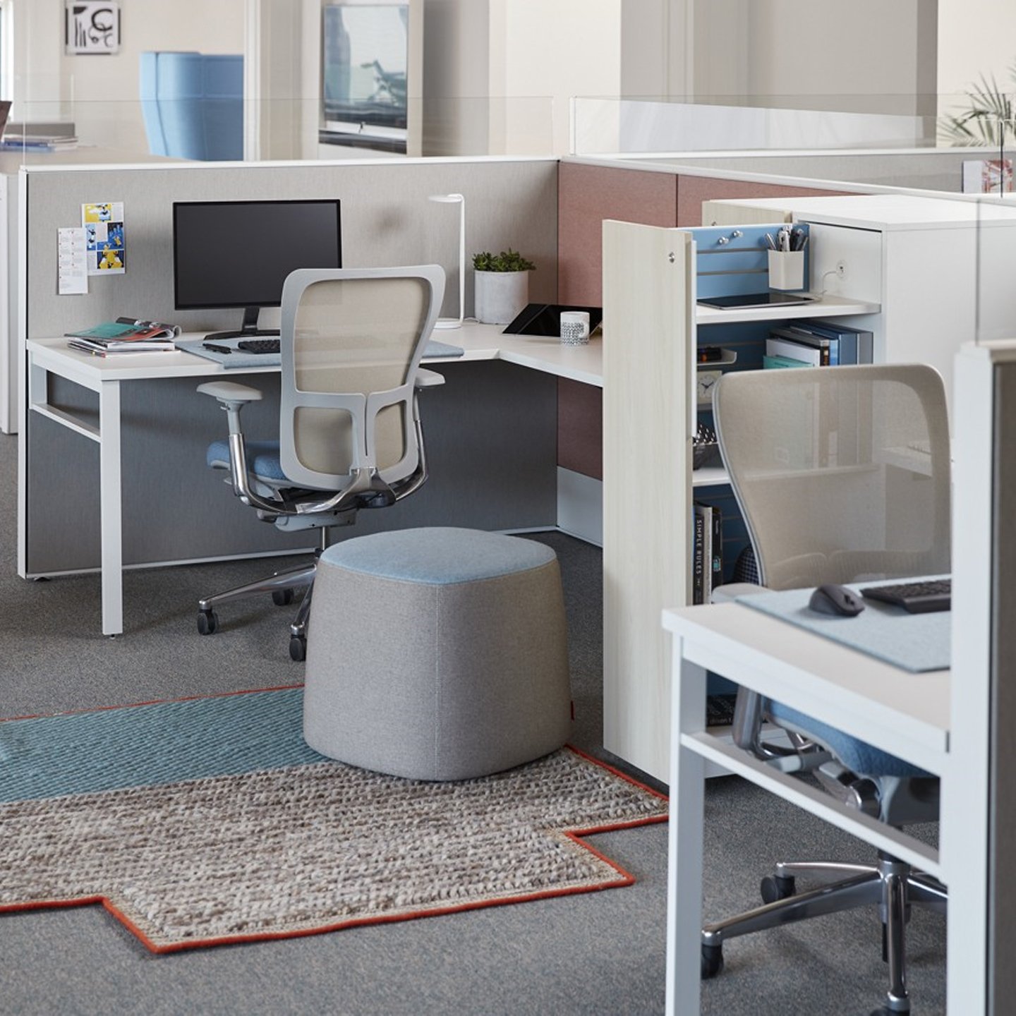 Haworth Compose Workspace in office space area with shelves and chairs and monitors facing opposite directions