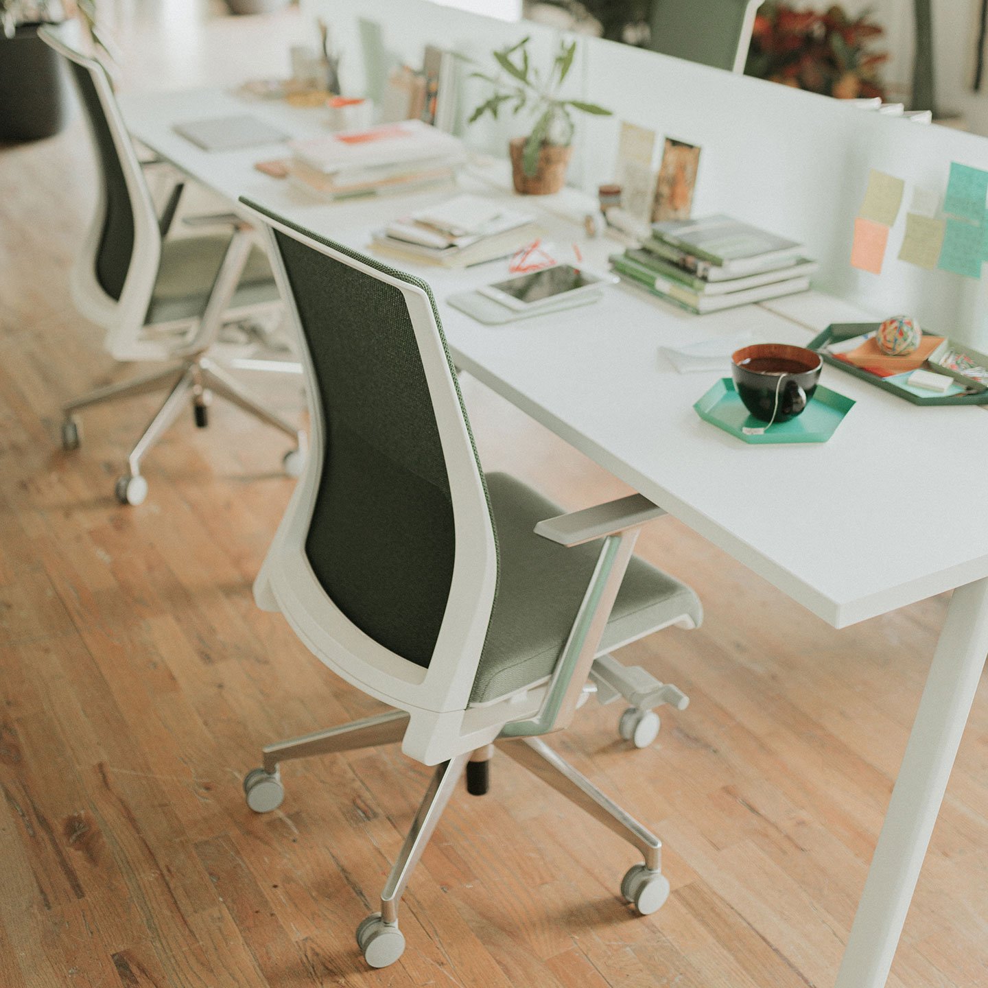 Haworth Intuity Workspace divider that are translucent in office with desks and chairs