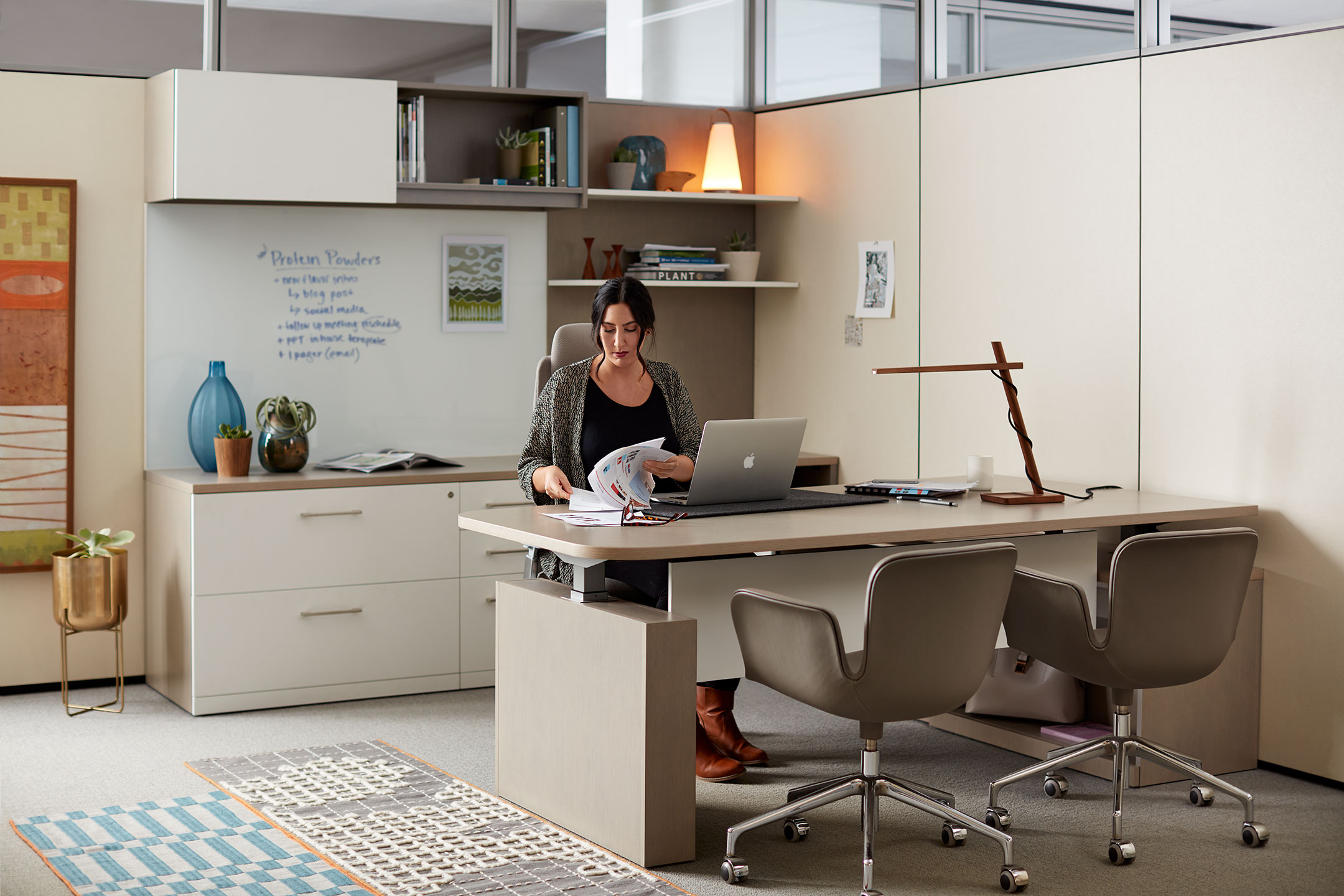 Haworth Masters Series Workspace in private office space with employee working at desk with whiteboard in the background