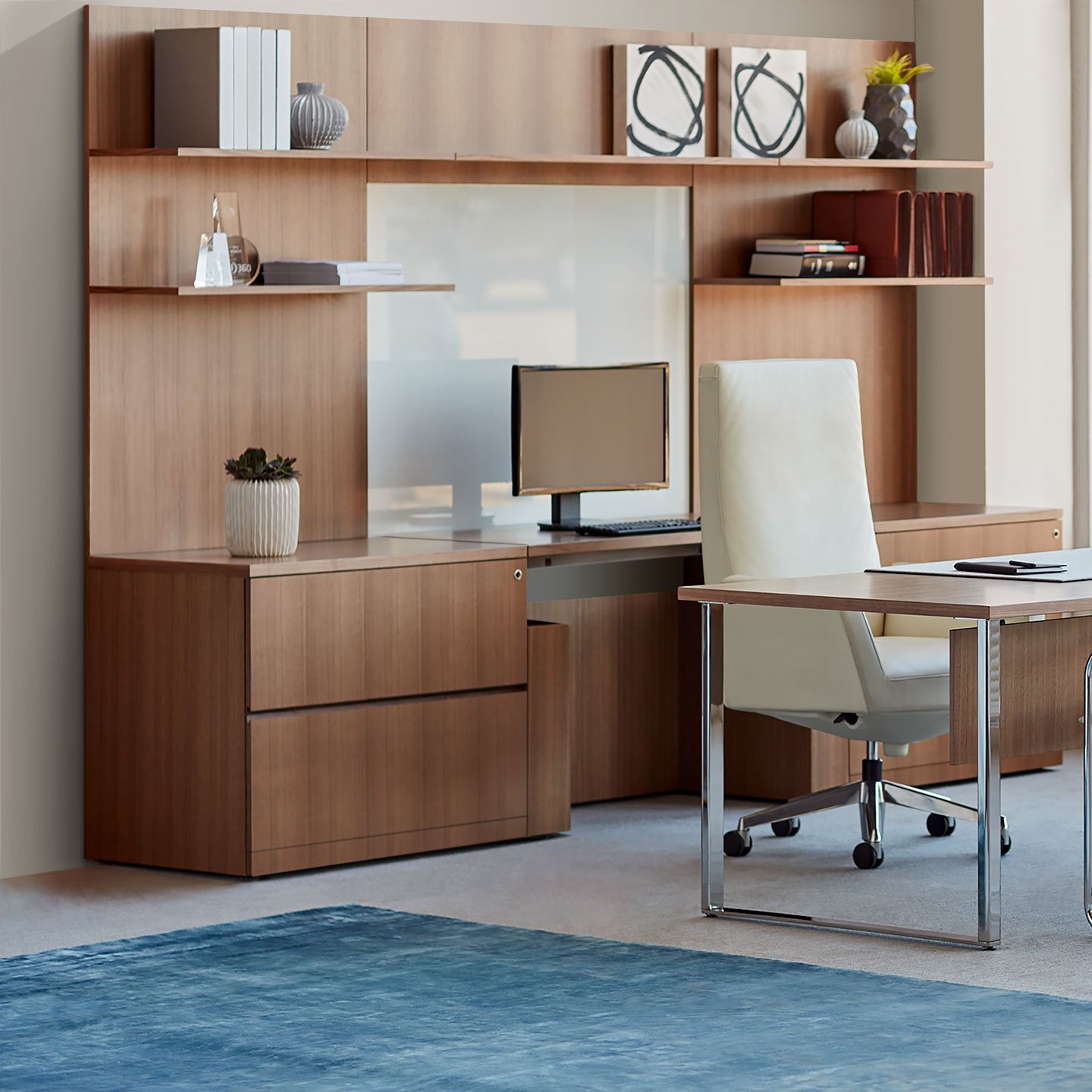 Haworth Masters Series Workspace with veneer desk in private office space with monitor and keyboard on it with white chair