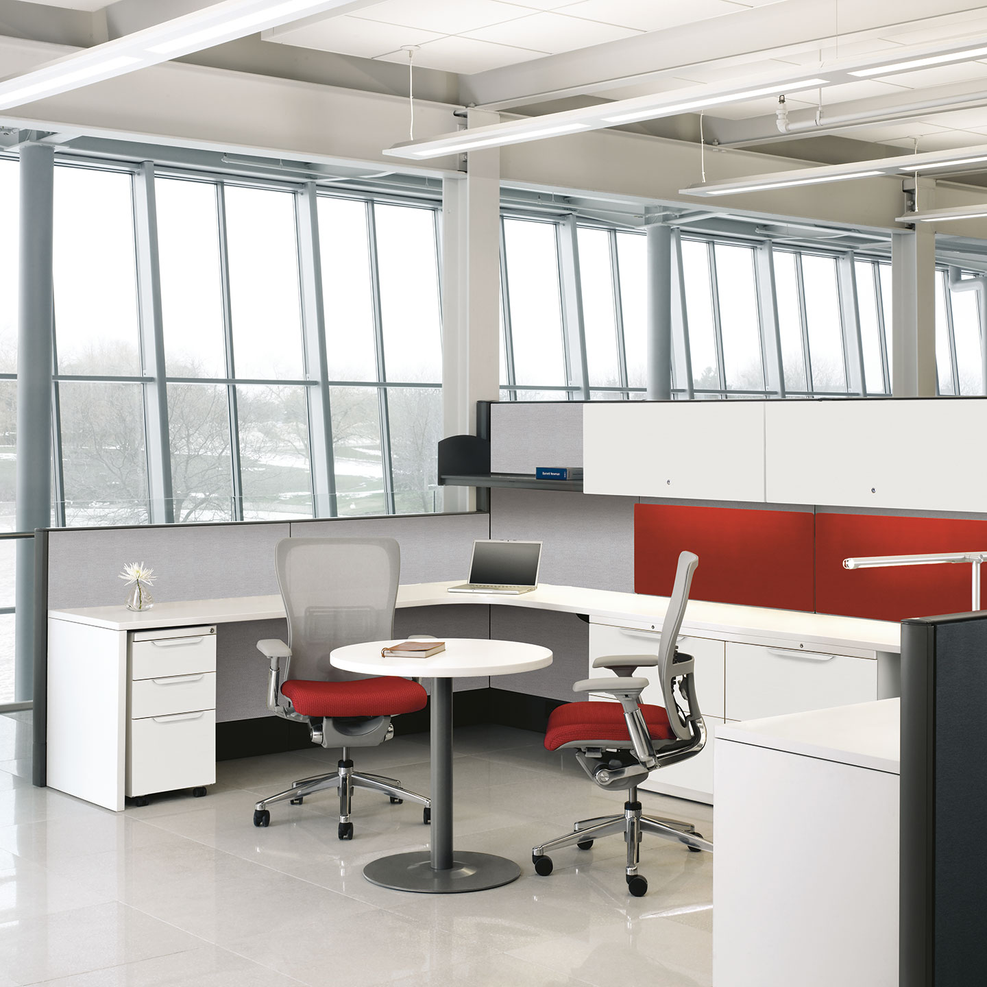 Haworth Premise Workspace in office space with 2 office chairs and laptop in private area for 2 employees to work