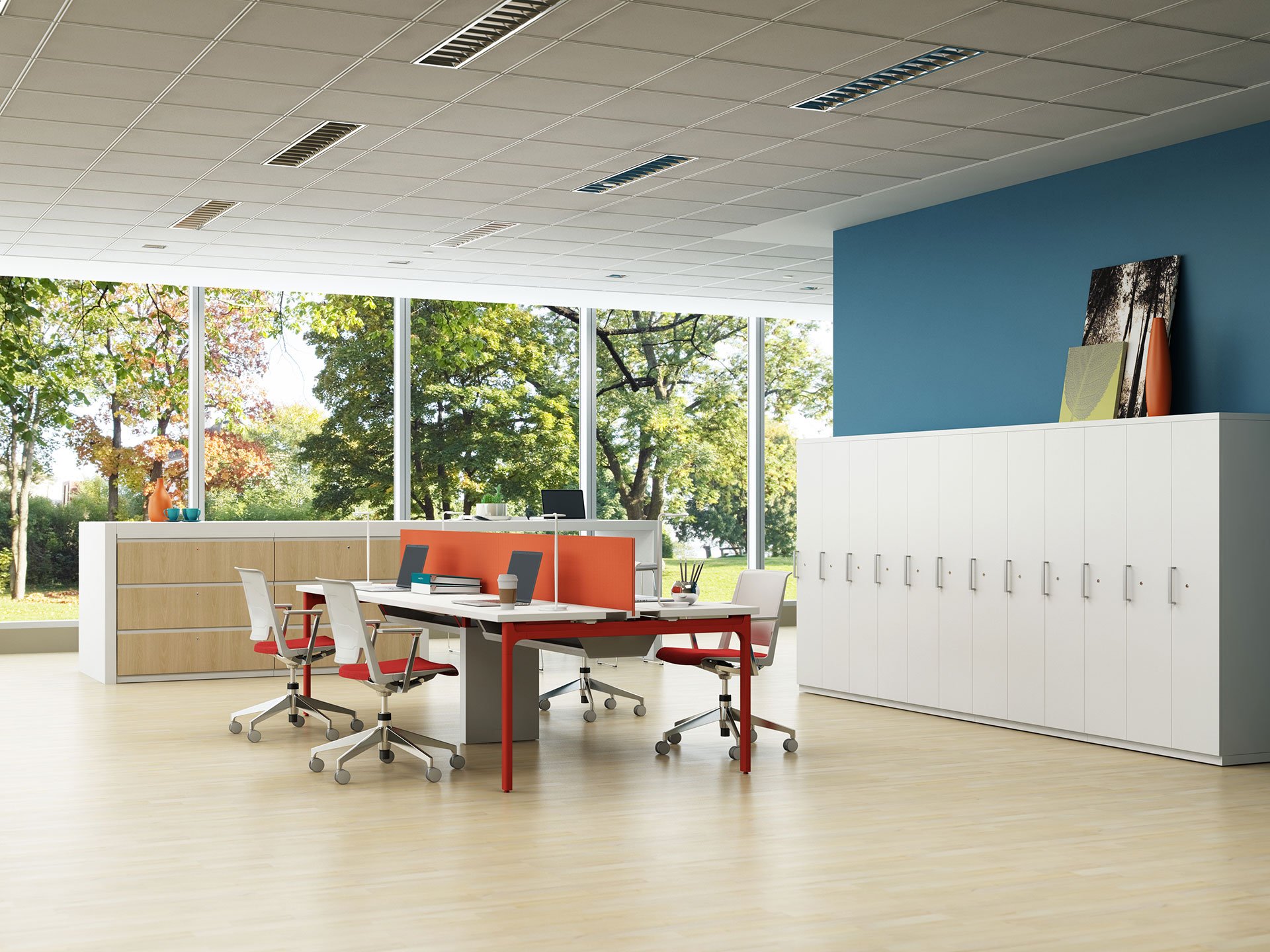 Haworth X Series Desks in open office space with center divider for privacy and laptops at desk with open window concept around office