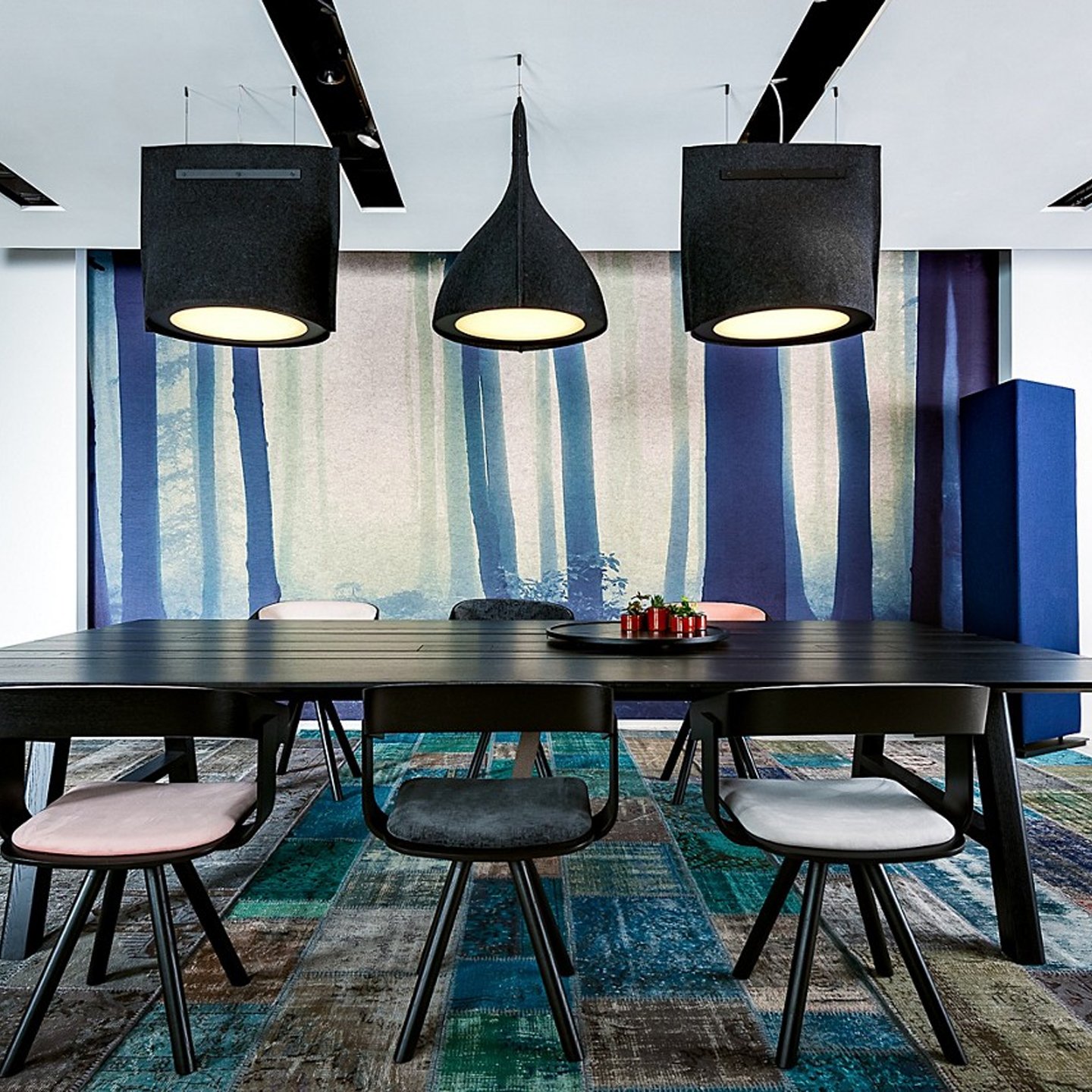 Haworth BuzziBell Lighting in felt above black office table with chairs around it 